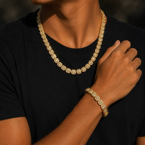 A close-up of a person wearing a gold-toned cubic zirconia necklace and matching bracelet, paired with a black t-shirt.