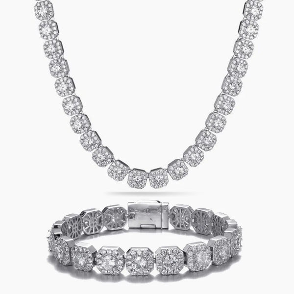 A silver-toned jewelry set featuring a matching necklace and bracelet, both adorned with round-cut clear cubic zirconia stones in a linked design, displayed on a clean white background.