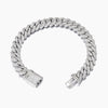 Silver Cuban bracelet with clear gemstones on a white background