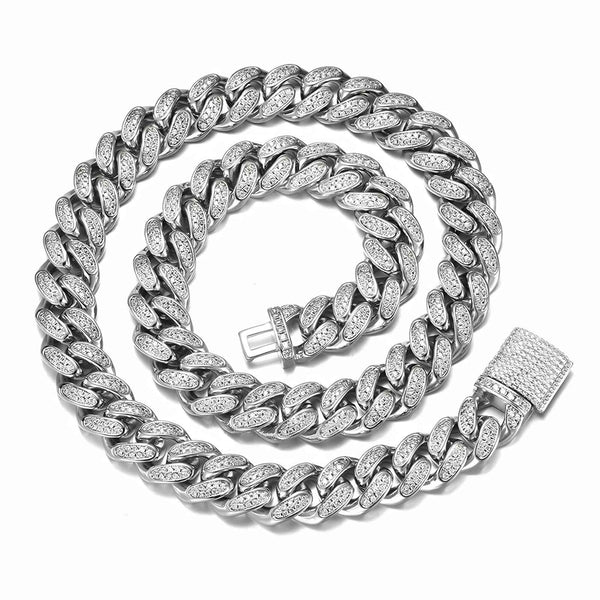 Silver cuban chain necklace with cubic zirconia stones on a white background