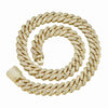 A thick gold Cuban link chain necklace, heavily embellished with small clear stones, coiled on a plain white background.