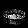 Silver cuban bracelet with a clasp on a black background