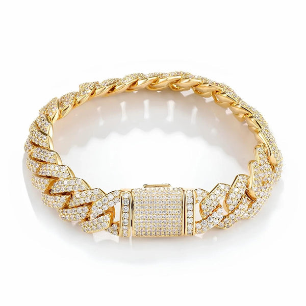 A gold-toned Cuban link chain bracelet paved with clear cubic zirconia stones, featuring a matching pavé clasp, shown on a clean white background.