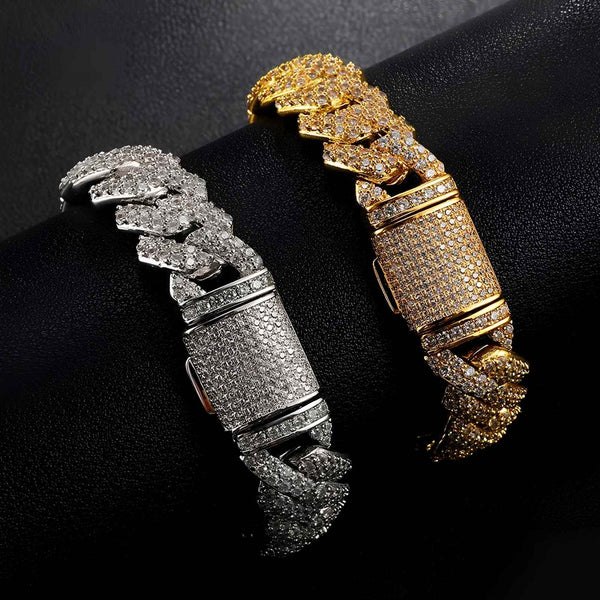 Two CUBAN bracelets, one gold and one silver, on a black background.