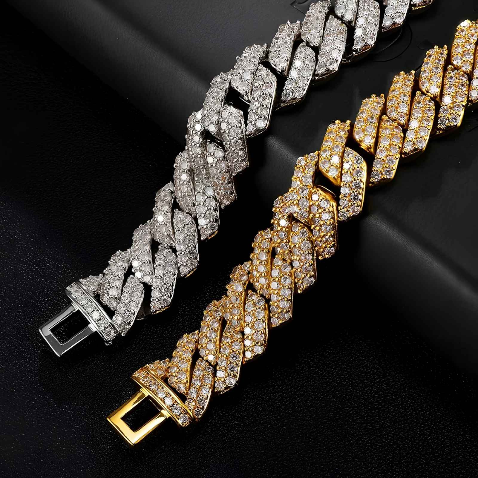 Two cuban bracelets, one silver and one gold, on a black background.