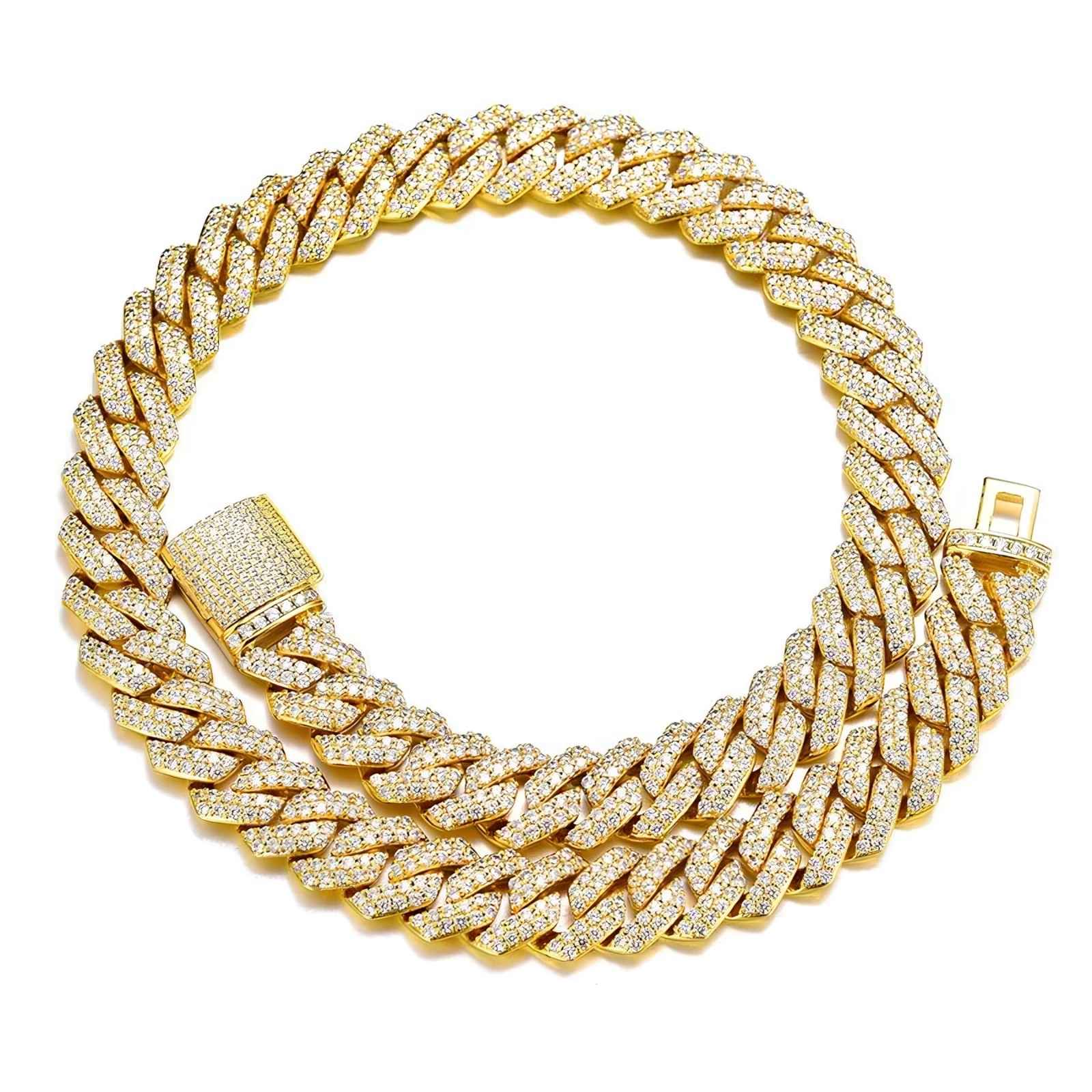 A thick gold Cuban link chain bracelet covered in small clear stones, shown on a plain white background. The bracelet has a matching gold clasp with a row of stones.