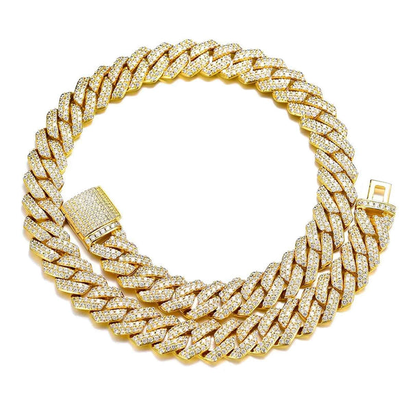 A thick gold Cuban link chain bracelet covered in small clear stones, shown on a plain white background. The bracelet has a matching gold clasp with a row of stones.