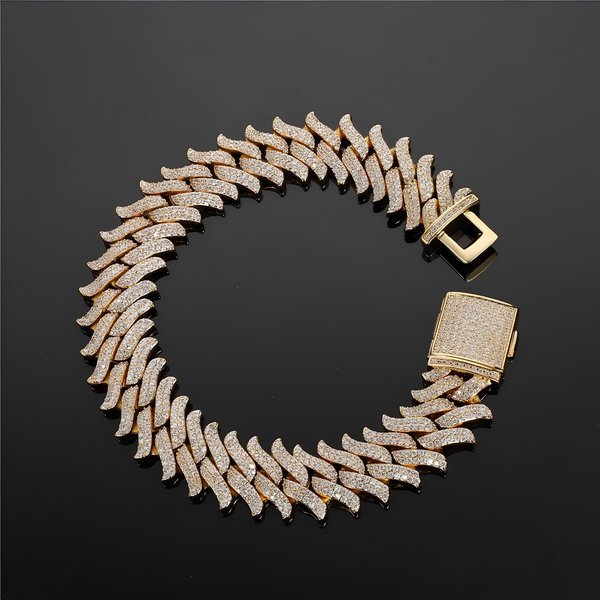 Angled view of 16mm iced gold spiked Cuban bracelet