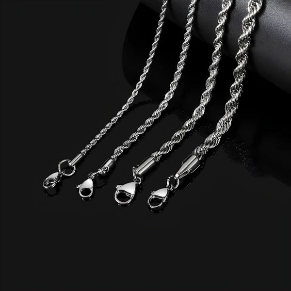 Three silver rope chain necklaces on a black background