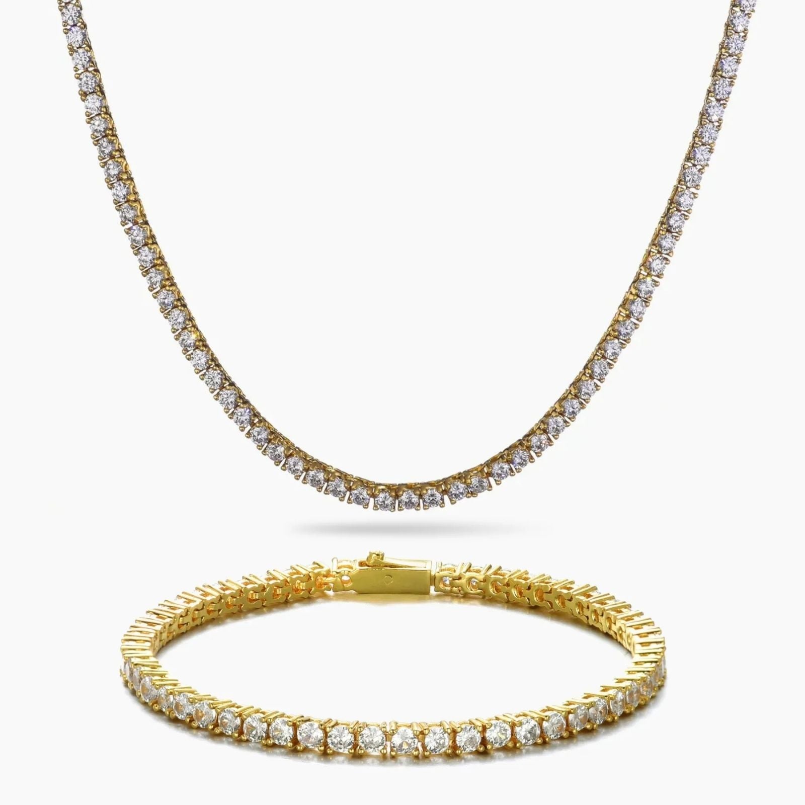 A gold tennis necklace and matching gold tennis bracelet, both adorned with clear cubic zirconia stones, displayed on a clean white background.