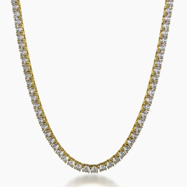 A gold tennis necklace paved with clear round-cut cubic zirconia, shown against a plain white background.