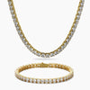 A gold tennis necklace and matching bracelet set, both paved with clear round cubic zirconia, displayed on a clean white background.