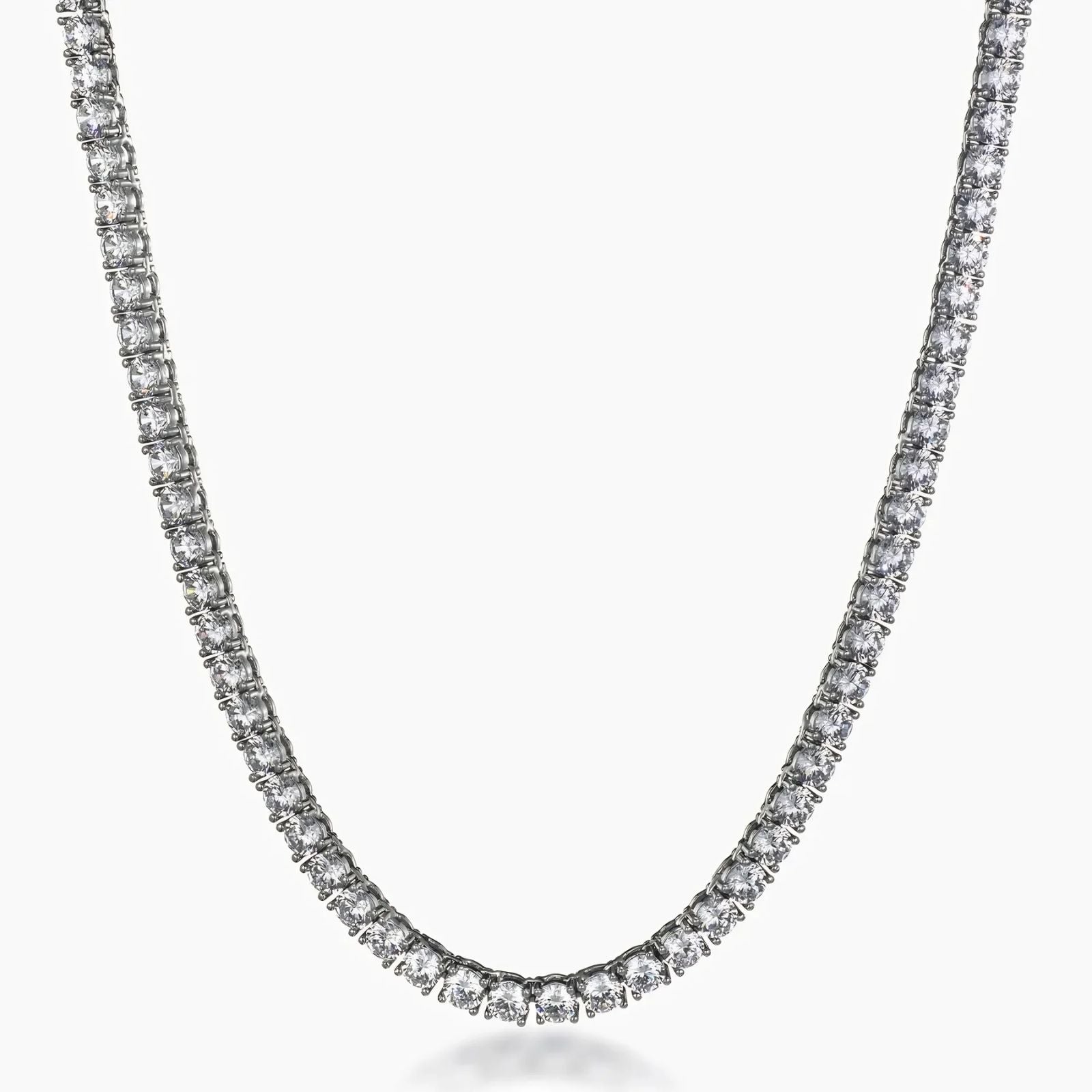 A tennis-style necklace with a continuous row of clear cubic zirconia in a silver-toned setting, shown against a plain light gray background.