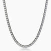 A tennis-style necklace with a continuous row of clear cubic zirconia in a silver-toned setting, shown against a plain light gray background.