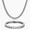 A silver-tone tennis necklace and matching bracelet set, both adorned with clear round-cut cubic zirconia, displayed on a clean white background.