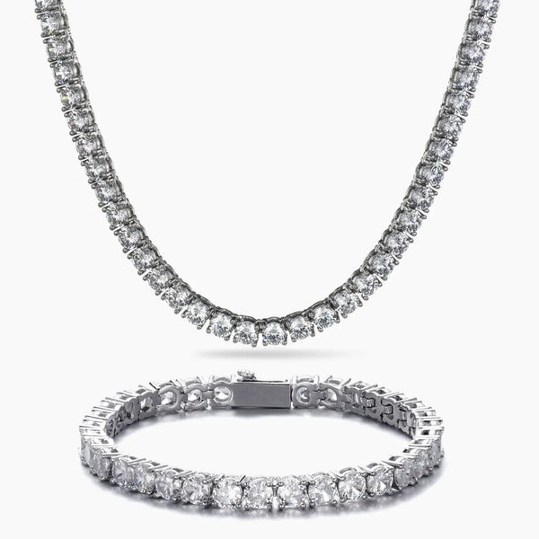 A silver-tone tennis necklace and matching bracelet set, both adorned with clear round-cut cubic zirconia, displayed on a clean white background.