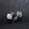 Angled view of 5mm moissanite stud earrings in 925 sterling silver