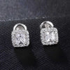Pair of silver square-shaped earrings with clear cubic zirconia on a black textured background