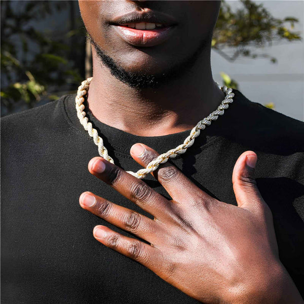 Man wearing a rope chain with a blurred background