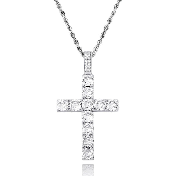 A silver cross pendant necklace paved with clear round-cut stones, hanging from a silver chain against a plain white background.