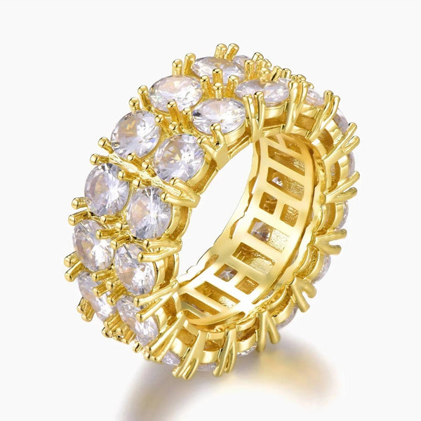 A gold-plated eternity ring featuring multiple round clear cubic zirconia stones set in a prong setting, shown on a light gray background.