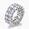 A silver-toned eternity ring featuring a double row of round brilliant-cut clear cubic zirconia on the front, with a lattice-like openwork band design on the sides, shown on a light gray background.