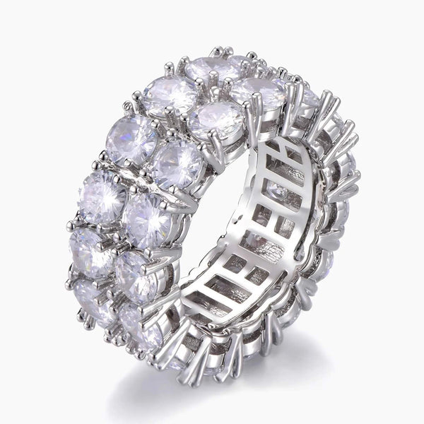 A silver-toned eternity ring featuring a double row of round brilliant-cut clear cubic zirconia on the front, with a lattice-like openwork band design on the sides, shown on a light gray background.
