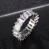 Silver ring with emerald-cut cubic zirconia on a dark textured background