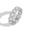 A silver-toned eternity ring featuring a row of round-cut clear cubic zirconia surrounded by small halo accents, photographed on a clean white background with a soft shadow.