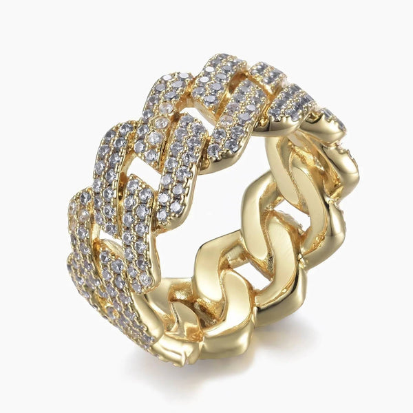 Gold cuban ring with cubic zirconia accents on a white background
