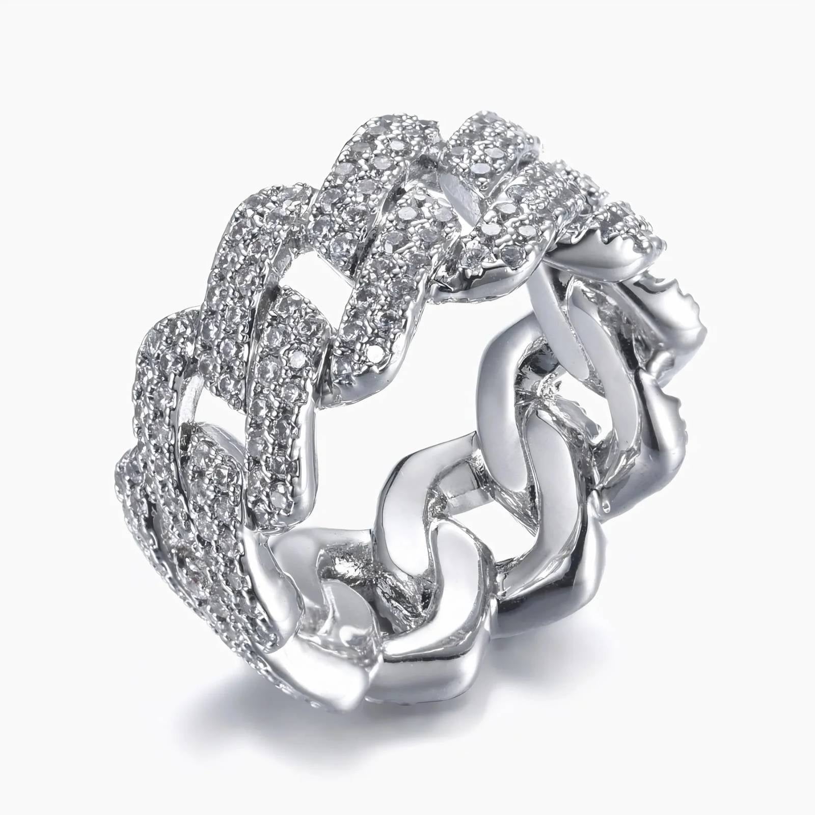 A silver-toned cuban-link ring paved with clear cubic zirconia stones, shown on a light gray background.