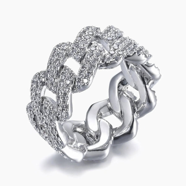 A silver-toned cuban-link ring paved with clear cubic zirconia stones, shown on a light gray background.
