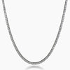 A silver-toned tennis chain necklace paved with small clear stones, shown against a plain white background.