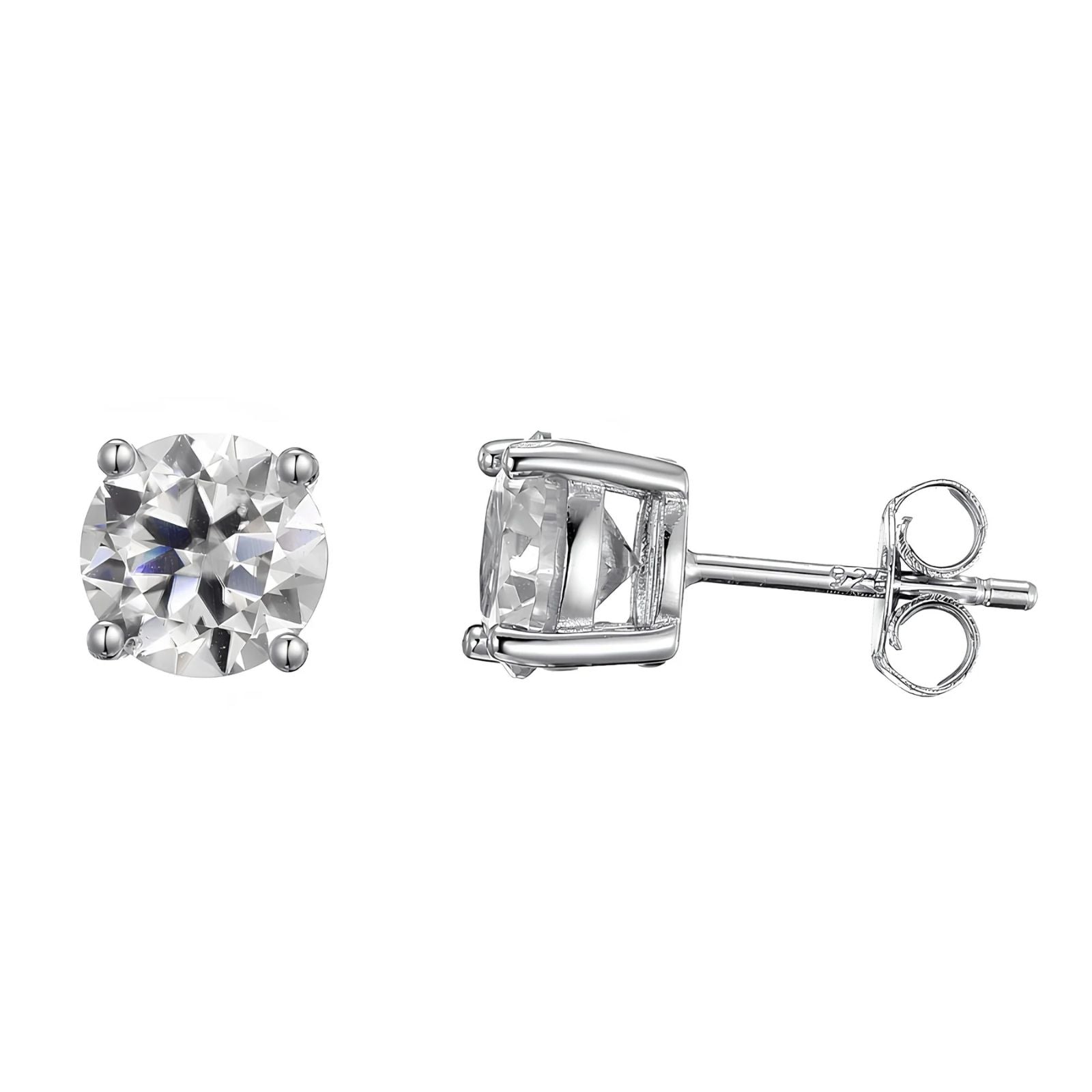 A pair of silver stud earrings, one shown from the front displaying a round brilliant-cut clear moissanite stone in a four-prong setting, and the other from the side displaying the post and butterfly back.