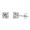 A pair of silver stud earrings, one shown from the front displaying a round brilliant-cut clear moissanite stone in a four-prong setting, and the other from the side displaying the post and butterfly back.