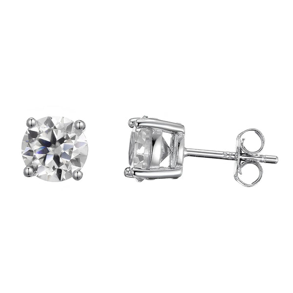 A pair of silver stud earrings, one shown from the front displaying a round brilliant-cut clear moissanite stone in a four-prong setting, and the other from the side displaying the post and butterfly back.
