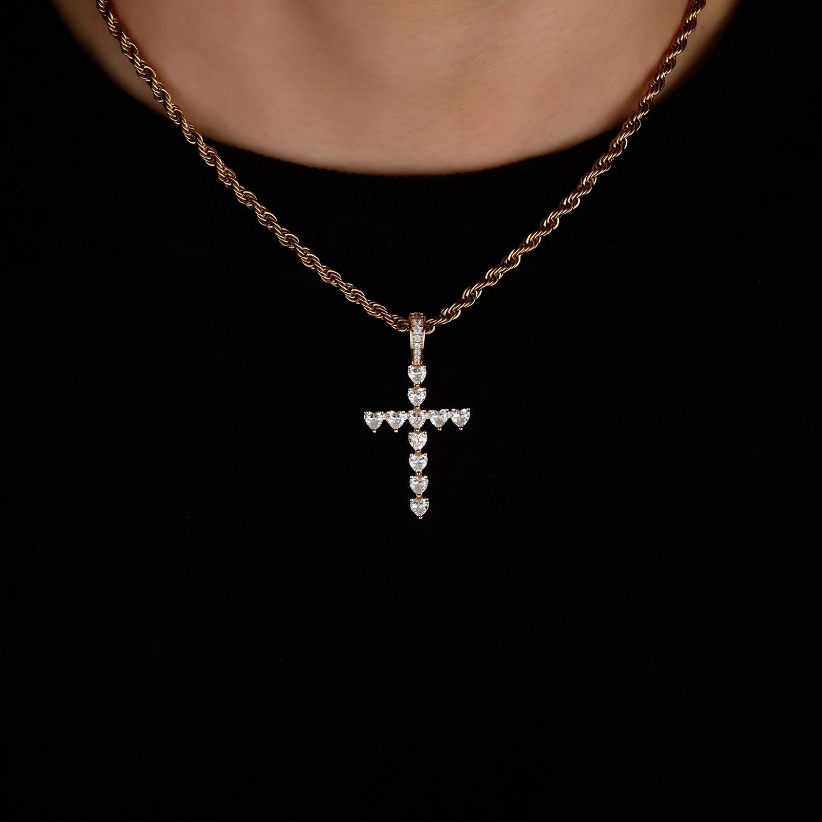 Model wearing the Classic Heart Cross Pendant in silver on a rope chain.