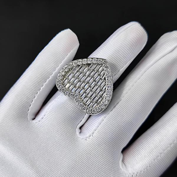 Woman wearing silver iced baguette heart ring