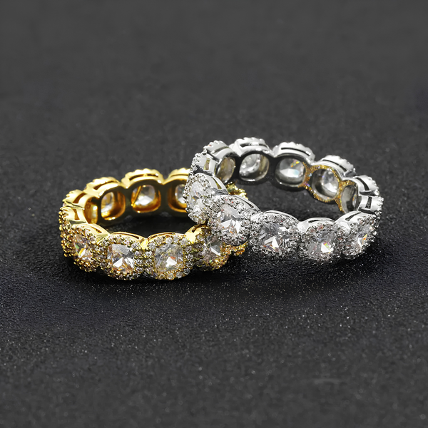 Gold and silver iced clustered tennis rings displayed together