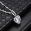 Angled view of silver iced heart halo pendant necklace on black display surface