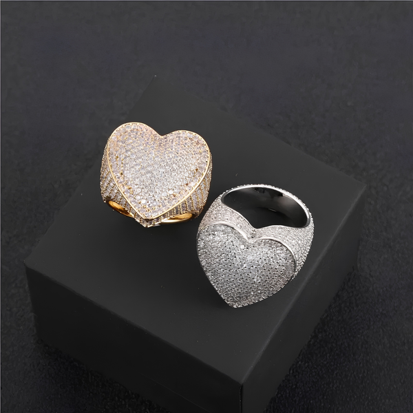 Gold and silver iced heart rings displayed side by side