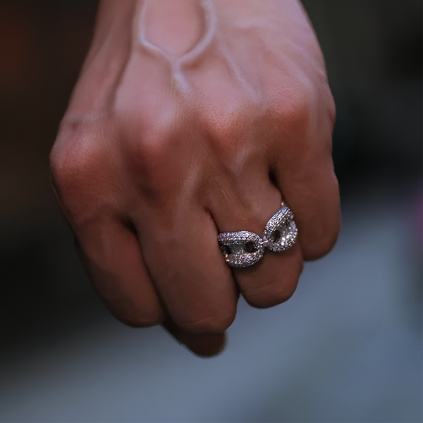Person wearing silver iced mariner ringPerson wearing silver iced mariner ring