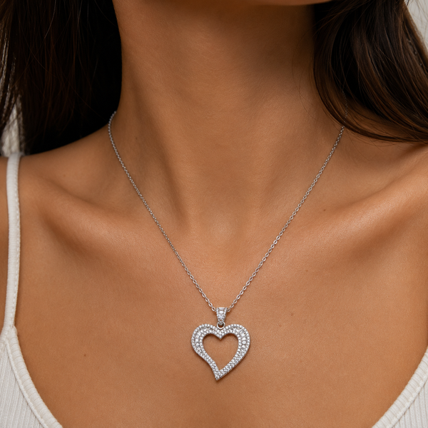 Woman wearing silver iced open heart pendant necklace