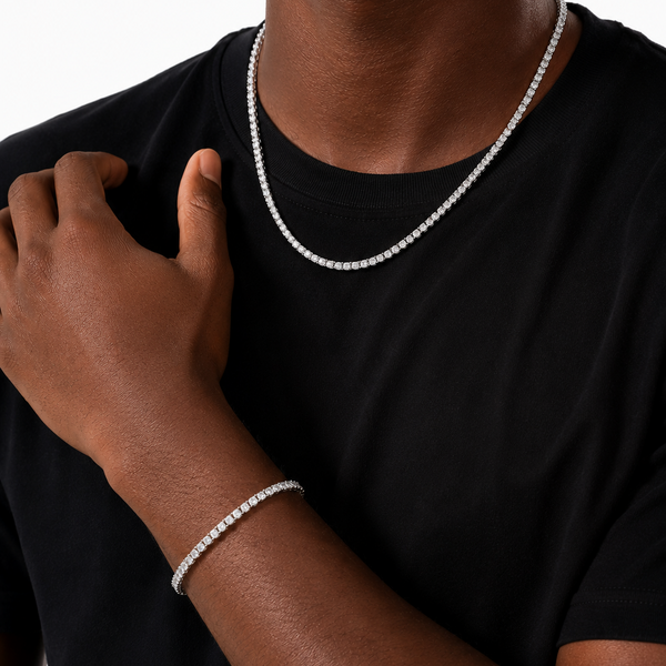 Man wearing a silver tennis chain and bracelet set