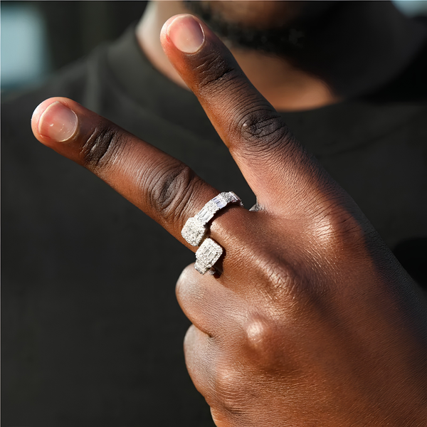 Model wearing a silver twisted baguette ring with sparkling cubic zirconia stones.