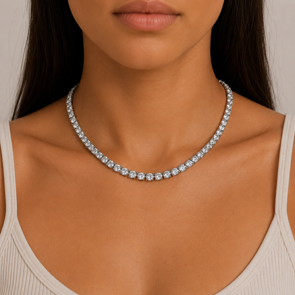 Woman wearing a 5mm silver tennis chain necklace featuring cubic zirconia stones.